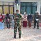 Koramil 0102/Cadasari Kodim 0601/Pandeglang, Kapten Inf. Mane tengah memberikan arahan kepada anggota beserta pegawai UPT Puskesmas Pagadungan jelang aksi pembagian masker gratis, Minaggu (06/09/2026) - (Foto: Istimewa)